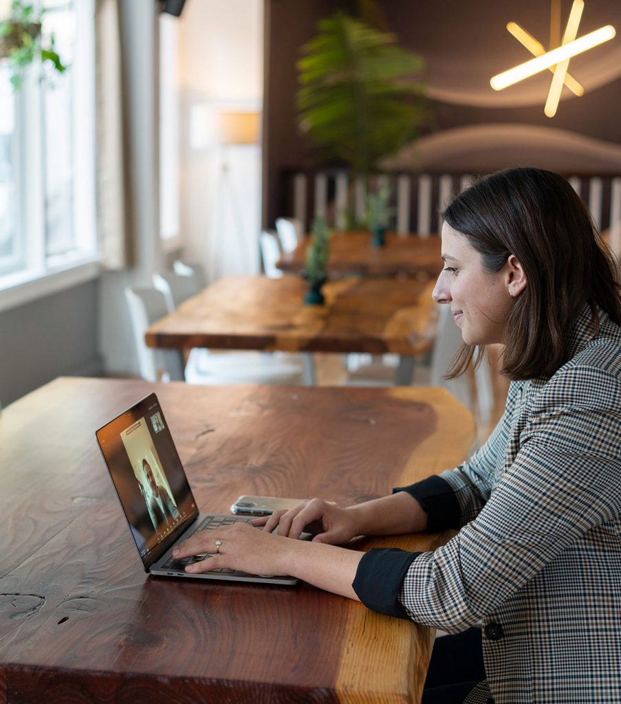 woman watching presentation on her laptop