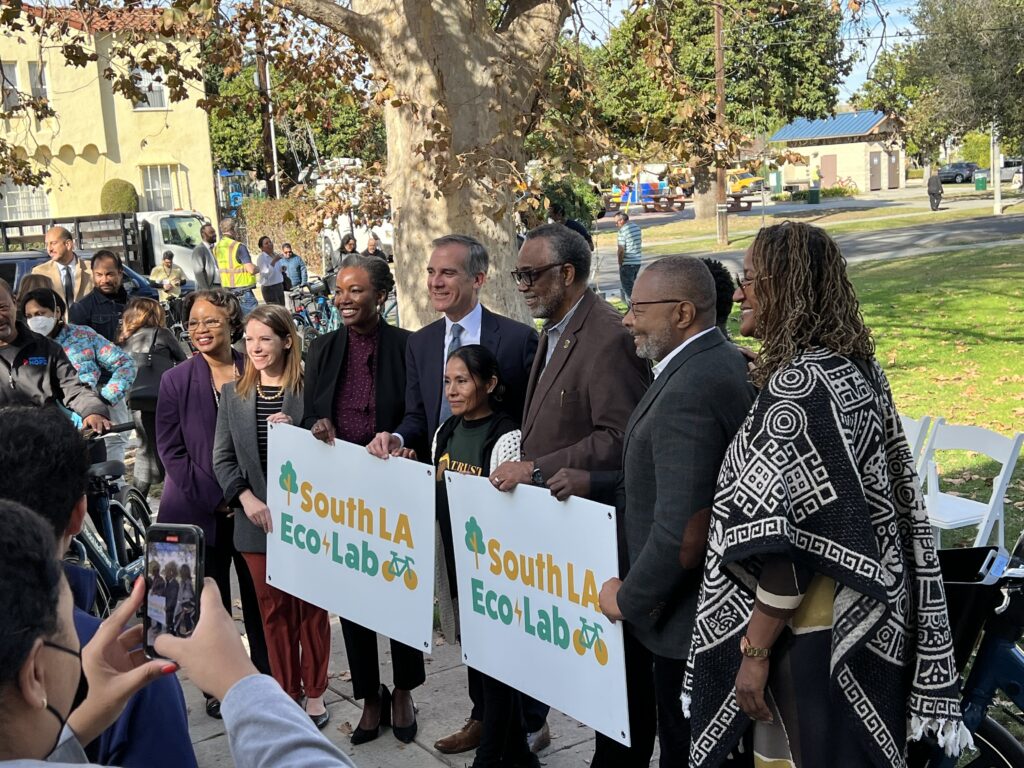 Group standing with South LA Eco Lab posters